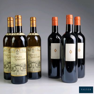 quatre bouteilles de vin sont alignées sur une table
