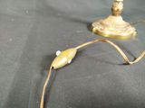 a lamp that is on a table with a cord