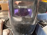 a welder mask that is sitting on a table