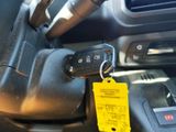 a car key in the center of a car with a yellow tag