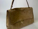 an image of a brown handbag on a white background