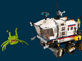 a lego robot and a lego alien on a blue background