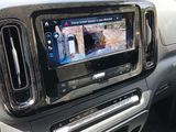 a picture of a car dashboard with a monitor in it