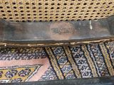 a close up of a chair on a rug on the floor