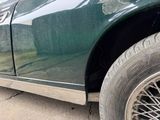 a close up of a car ' s tire with a hole in the side