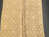 a louis vuon scarf on display in a museum