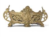 an antique brass planter on a white background with a white background
