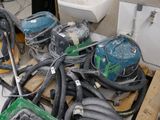 a pile of vacuums and other equipment on a pallet