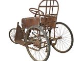 an old rusty car that is sitting on a white surface