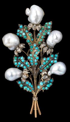 une image représentant une broche ornée de perles et de pierres de turquoise