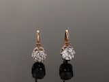 an image of a pair of diamond and gold earrings