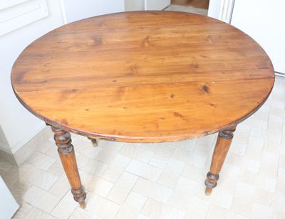 a wooden table with a wooden top in a kitchen