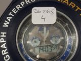 a close up of a clock on a table