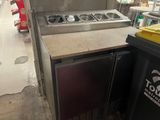 an image of a kitchen with a sink and a stove