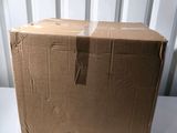 a cardboard box sitting on top of a white table