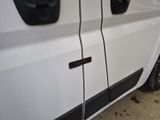 a close up of a car door with a number plate on it