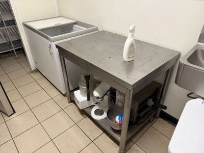 a kitchen with a sink and a washer in it