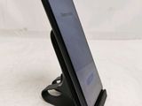 a cell phone that is sitting on a stand