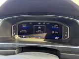 the dashboard of a car with a digital display in the center