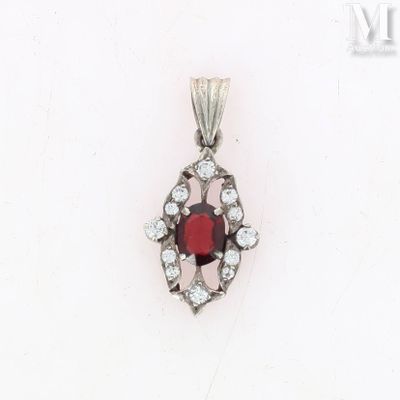 a close up of a red and white diamond pendant on a white background