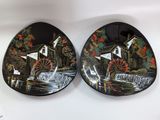 pair of black and white plates with a mill scene on them