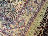 a rug on the floor with a cat laying on it