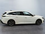 a white car is parked in a room with a gray floor