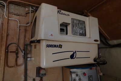 a water heater that is on the wall in a room