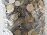 a bag full of coins sitting on a table