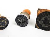 three waxed stamps with a stamper and a stamper on them