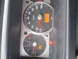 a close up of a car dashboard with various gauges