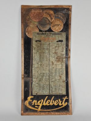 a close up of a sign on a wall with a clock on it