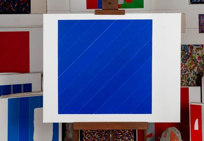 a picture of a painting on a easel in a room