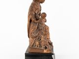 a statue of a woman holding a child in her lap