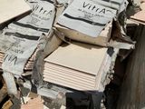 a pile of cardboard sitting on top of a pile of wood