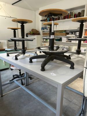 a table with a bunch of stools on it