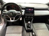 a picture of the interior of a car with a steering wheel and dashboard