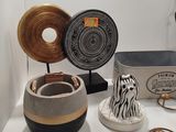 many different items on display on a white table