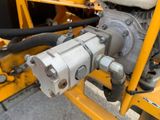 a close up of a machine with a hose attached to it