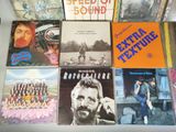 a lot of records that are on a table