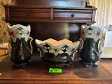 three vases that are sitting on a table