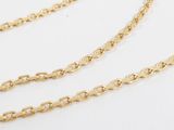 a close up of a gold chain on a white background