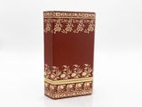 an image of a red and gold book with gold trim