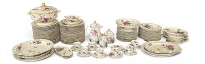 many pieces of pottery that are sitting on a table