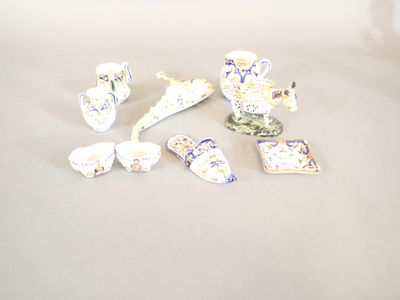 a lot of small pieces of porcelain sitting on a table