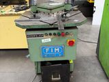 a machine that is sitting on the ground in the garage