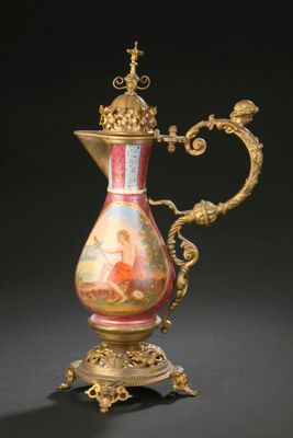 a gold and red vase on a stand on a black background