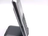 a cell phone that is sitting on top of a stand