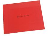 a close up of a red box with a black writing on it