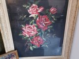 a picture of a painting and a picture of a vase of flowers